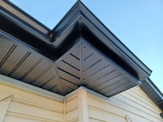 Soffit mitered on a gable where the wall changes shape