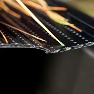 Pine needles held on the surface of a gutter guard